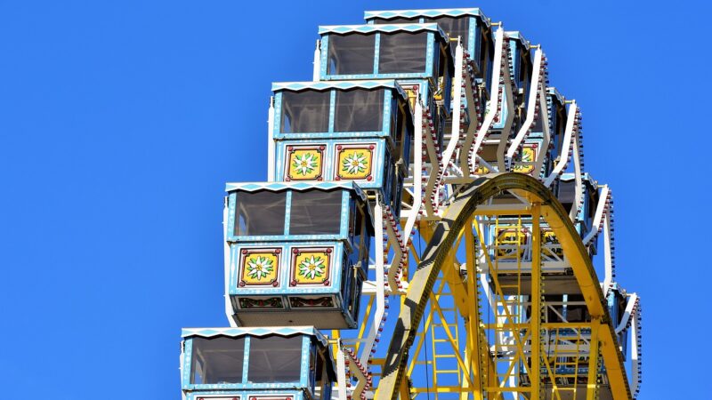 People on the yellow big wheel